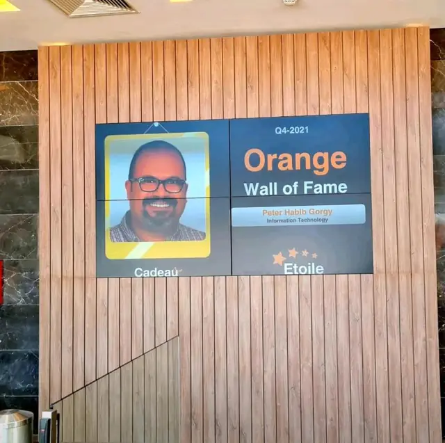 Orange Wall of Fame screen, Q4 2021: Peter Habib Gorgy, Information Technology, with his photo (Cadeau · Etoile).